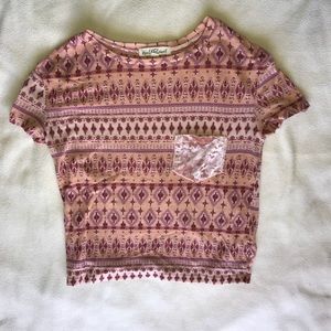 Pink Aztec print cropped top.